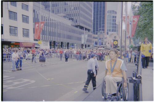 [Australian Paralympic athletes make their way into the spectator area for the presentation of the key to the city ceremony, Sydney Town Hall, 30 October, 2000] [picture] / Jim Nomarhas