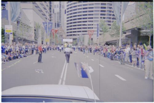 Crowded streets during the Paralympic street parade [George Street, Sydney, 30 October, 2000] [picture] / Jim Nomarhas