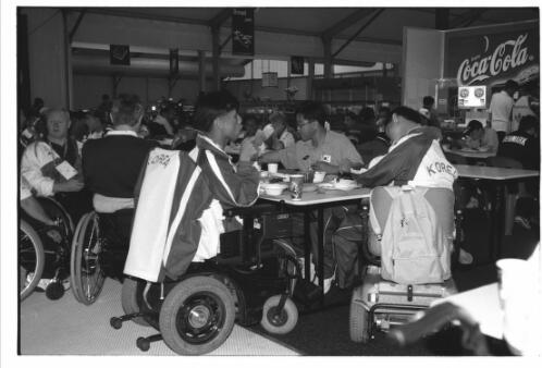 Korean team members in the dining hall in the Paralympic Village, Sydney 2000 Paralympic Games, 16 October 2000 [picture] / Jim Nomarhas