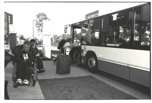 View of athletes arriving and disembarking by bus at the Paralympic Village, Sydney 2000 Paralympic Games, 16-17 October 2000 [picture] / Jim Nomarhas