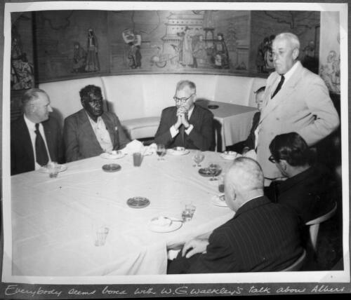 Albert Namatjira at a meeting with a group of unidentified men [picture]