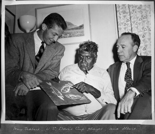 Albert Namatjira pointing at an artwork to Davis Cup player Tony Trabert and an unidentified man [picture]