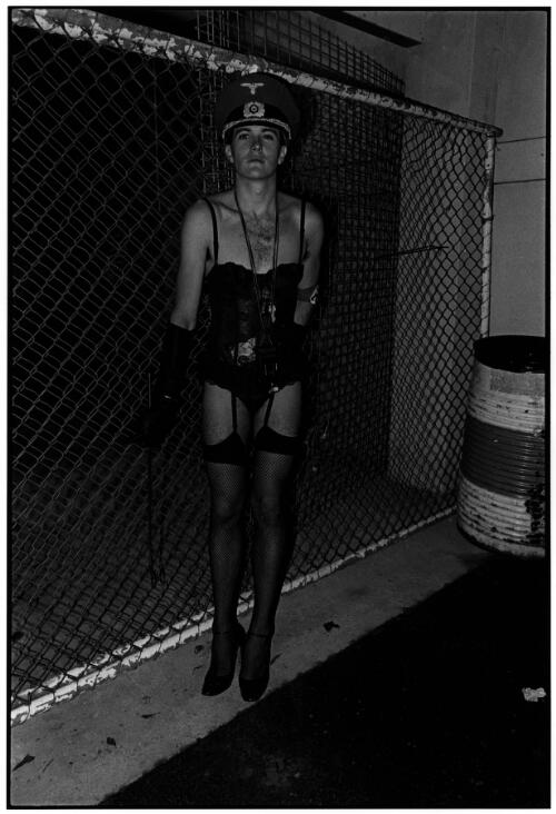 Man wearing Nazi armband and compact camera : Mardi Gras cabaret at Horden Pavilion, Driver avenue, Paddington, February 21, 1987 [picture] / Satoshi Kinoshita