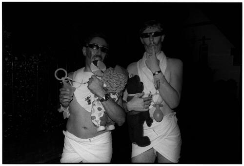 Two adults dressed in baby clothes : Mardi Gras parade, 21 February, 1987 [picture] / Satoshi Kinoshita