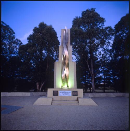Rats of Tobruk Memorial, pictured at night, Anzac Parade, Canberra, 2002 [transparency] / Damian McDonald