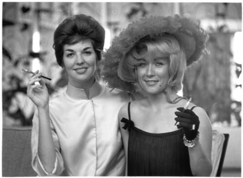 Two American strippers, recently arrived in Sydney to take up an engagement at the Pink Pussycat Nightclub, managed by "Last Card" Louis Benedetto, Kings Cross, 1961 [picture] / Jeff Carter