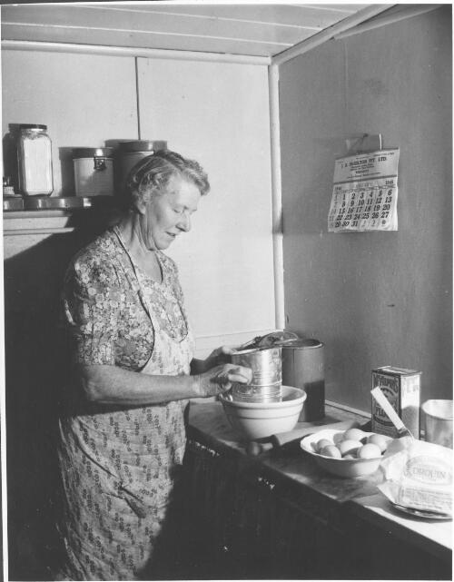 Mrs Robert Wharton making a cake in her kitchen, Drouin, Victoria, 1945 [picture]