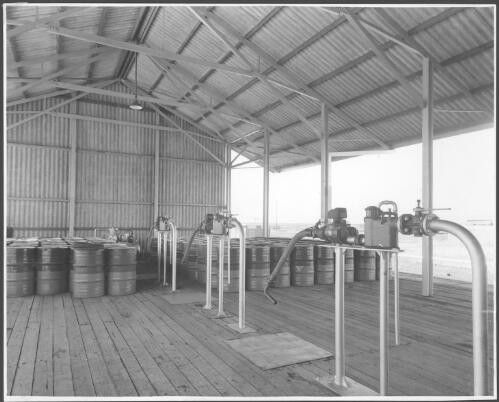 View of the Brodie meters on the drum filling platfrom, seaboard terminal, Birkenhead, South Australia, 1949 [picture] / C.B. Hayward