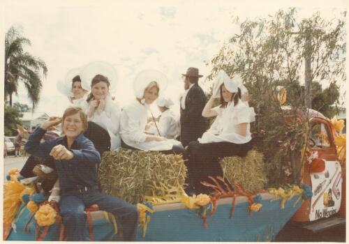 View of the Golden Fleece float decorated for a parade with unidentified parade participants dressed in colonial costume on the back at Goondiwindi, Queensland, 1974 [picture]