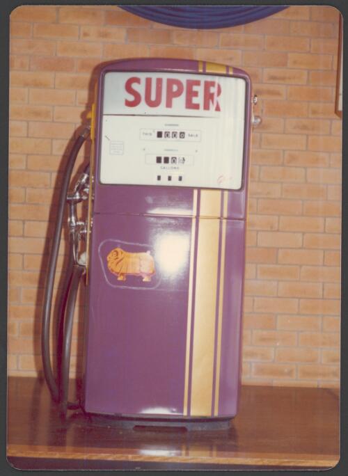 Interior view of Golden Fleece office foyer showing a purple petrol pump with yellow strip [picture]