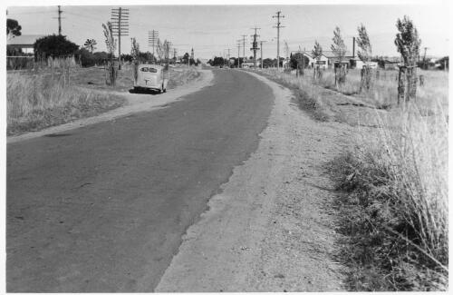 Coming into Harden from the Yass-Bowning direction, the depot site and dairy factory are on the right hand side, February 1956 [picture]