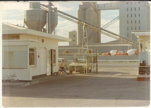 View of the despatch office and gate looking east towards storage tanks and other equipment at an unidentified depot, 20 June, 1976 [picture]
