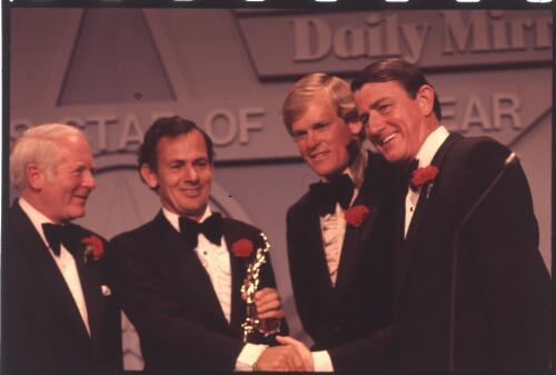 David Graham being presented with the Sportstar of the Year trophy at the awrds ceremony by Neville Wran [picture]