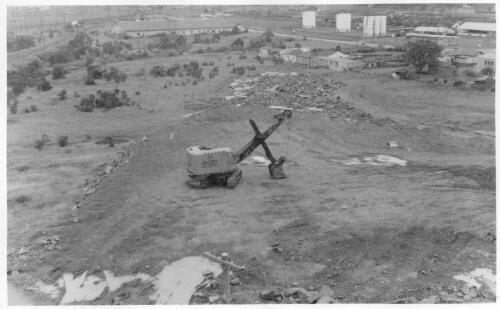 View of a power shovel at the filling site at the Port Kembla shipping terminal during construction, March, 1959 [picture]