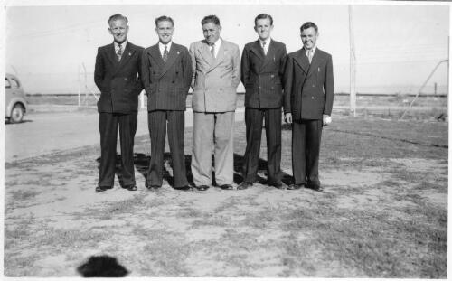 Portrait of the operations staff, from left to right, Leading Hand Ross Fowler, Driver L.D. "Snow" Adams, Foreman D. Sawtell, Oil Storeman Ricard Christie and Drum Filler Alan Dougherty, December, 1948 [picture]