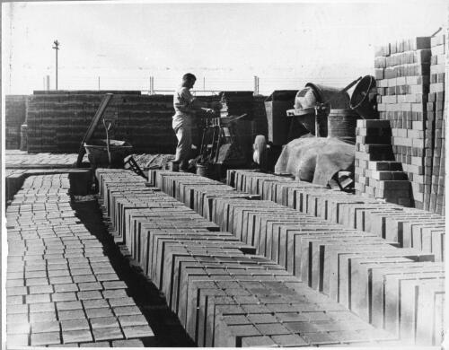 Construction workers making concrete bricks during the construction of the new administration office, Birkenhead depot, August, 1950 [picture]