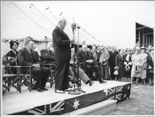 Mr. W.G. Walkley addressing guests from a dais at the opening of the Birkenhead terminal, 29 September, 1950 [picture]