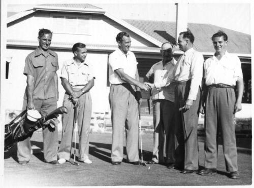 Mr. S. Britton hands the "OK" Callaghan Golf Cup winner's trophy to J. Flanagan at the Glenelg Golf Course, South Australia, December, 1951 [picture]
