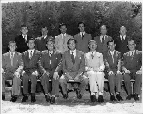 Portrait of the sales staff consisting of Frank Patten, V. Medlin, Ron Jensen, J. Langford, W. Lane, E. Bond, J. Geraghty, J. Richards, Ted Atkinson, K.B. Alford, C. Dempster, G. Randle and W. Stockham, 14 January, 1952 [picture]
