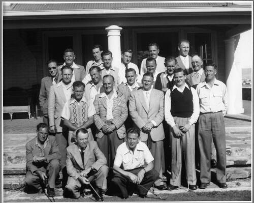 Portrait of the competitors taking part in the "OK" Callaghan Golf Cup in front of the clubhouse at the Glenelg Golf Course, South Australia, December, 1952 [picture]