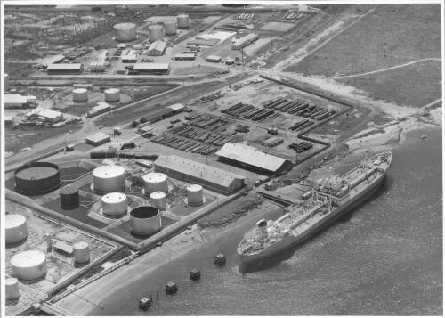 Aerial view of the seaboard terminal showing the William G. Walkley discharging its cargo into the Ampol pipelines at Caltex Wharf,  Birkenhead, South Australia, October, 1955 [picture]
