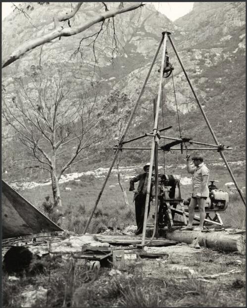 Diamond drilling, Wee Georgie drilling rig, near the Mackintosh Dam site, Tullah, Tasmania, 1950s [picture] / Russ Ashton