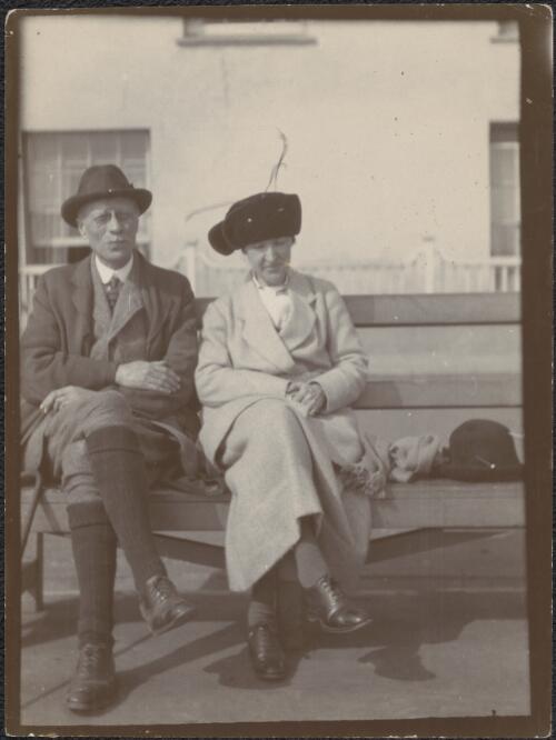 Henry Handel Richardson and husband, John George Robertson on a garden seat, Lyme Regis, England, approximately 1930