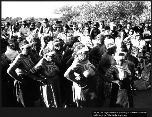 Part of the large audience watching a traditional dance performed by Pitjantjatjara women [picture] / prepared by Media and Communications, Department of Aboriginal Affairs