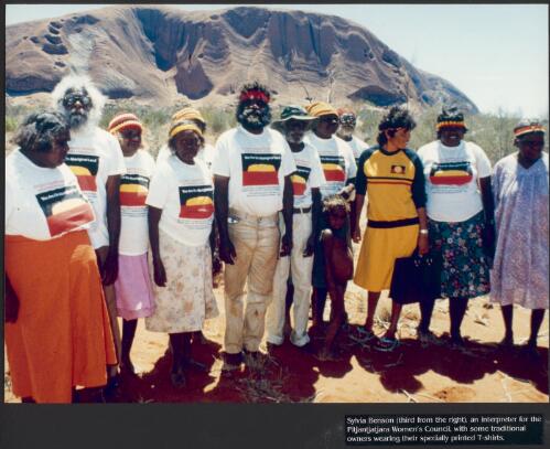 Sylvia Benson (third from right), an interpreter for the Pitjantjatjara Women's Council, with some traditional owners wearing their specially printed T-shirts [picture] / prepared by Media and Communications, Department of Aboriginal Affairs