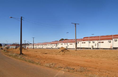 Accommodation compound, exterior view, Baxter Immigration Reception and Processing Centre, near Port Augusta, 12 July, 2002 [picture] / Damian McDonald