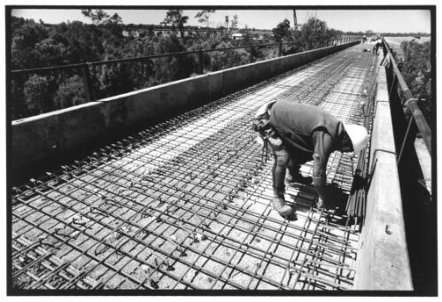 Katherine River Bridge, a metal framework is breaded, and cement will be poured into this, the track will lie on top, Katherine, 5 August, 2002 [picture] / Anya van Lit