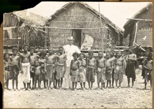 [Evan R. Stanley with unidentified village children, New Guinea] [picture]