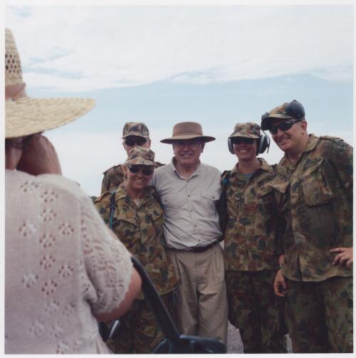 Australian Prime Minister John Howard is photographed with soldiers at Dili airport, East Timor, 28 November 1999 [picture] / Matthew Sleeth