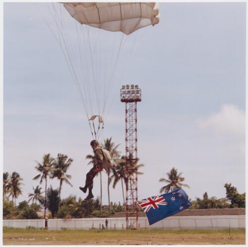 A New Zealand soldier parachutes into Dili stadium to help distribute toys to East Timorese children on Christmas Day [picture] / Matthew Sleeth