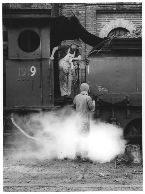 Engine driver instructing an apprentice, Eveleigh Railway Workshops, Sydney, 1968 [picture] / Raymond de Berquelle