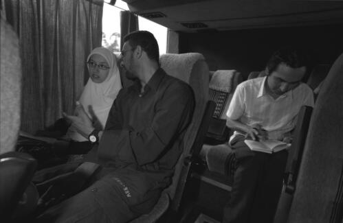Samar Alarwi and her husband, Bilal Alam, and (back seat) Kuranda Seyit, Media Manager of AFIC, travelling from Sydney to Denman in the Hunter Valley to attend the 'Salatul Istisqa', the Islamic rain prayer, 19 January 2003 [picture] / Paul Cosgrave