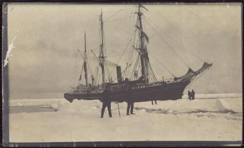 [Expedition members on ice in front of Nimrod with smoke coming out of funnel, Shackleton Antarctic expedition, 1907-1909] [picture]