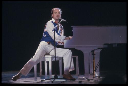 Peter Allen performing at the opening of the Sydney Entertainment Centre, 1 May, 1983 [transparency] / Don McMurdo