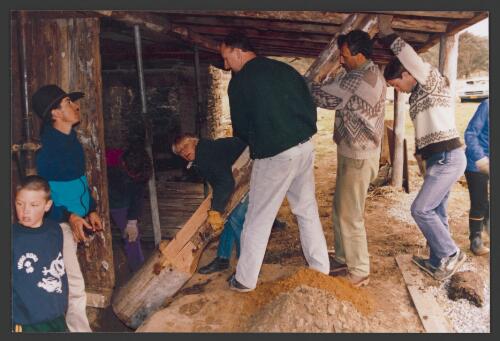 Work party at Brayshaws showing the installation of a post, April 1993 [picture]