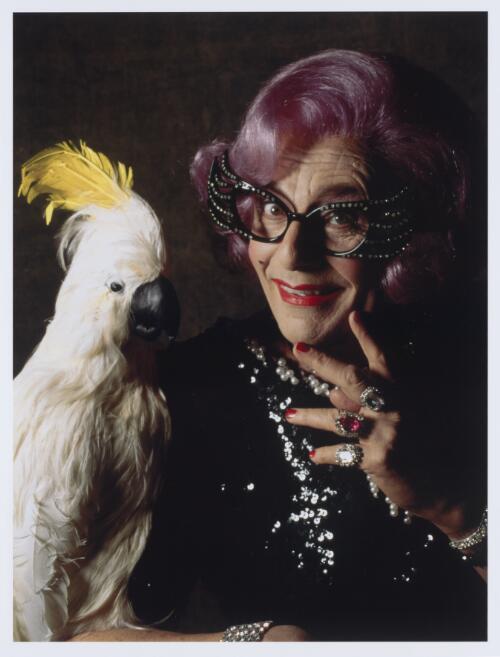 Portrait of Dame Edna in cockatoo dress, 1997 [picture] / Lewis Morley