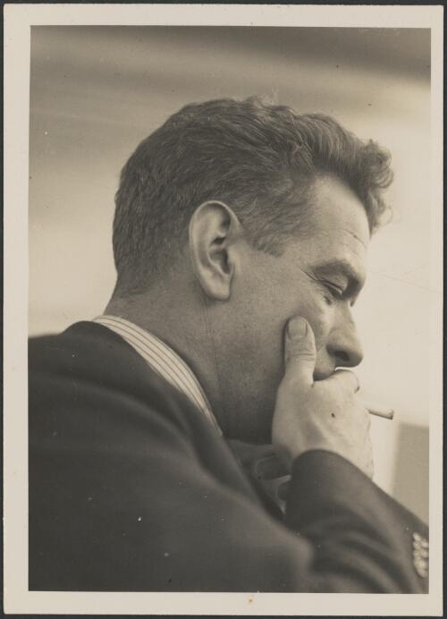 Charles Ulm smoking a cigarette, ca. 1934 [picture] / Auckland Weekly News