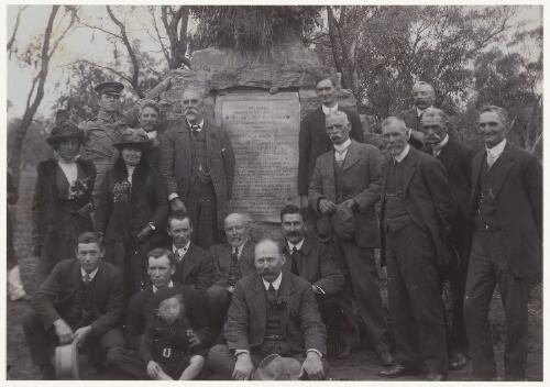 Group of men gathered around the John Oxley expedition monument, Goobothery Hill, New South Wales, ca. 1914 [picture] / Edmund Milne