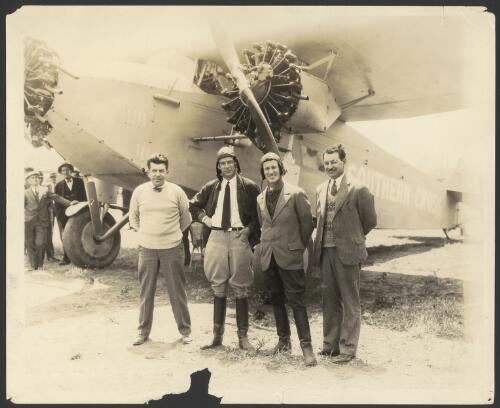 Portrait of Harry Lyon, Charles Ulm, Charles Kingsford Smith and James Warner in front of the Southern Cross, a Fokker F.VII/3m monoplane, VH-USU, Los Angeles, California, United States, 23 May 1928 [picture] / H.B. Miller
