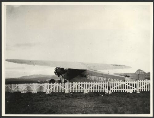 The Southern Cross, Fokker monoplane F.VII/3m, VH-USU behind a fence, Canberra, June 1928 [picture]