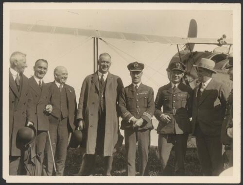 Mayor of Auckland, George Baildon, and four other men farewelling Charles Kingsford Smith and Charles Ulm on their departure from Auckland, New Zealand, September 1928 [picture]