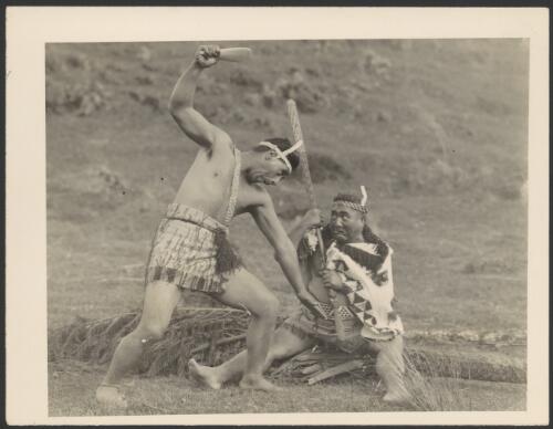 Dramatisation by two men in Maori costume for crew of the Southern Cross, at Rotorua, New Zealand, September 1928 [picture]