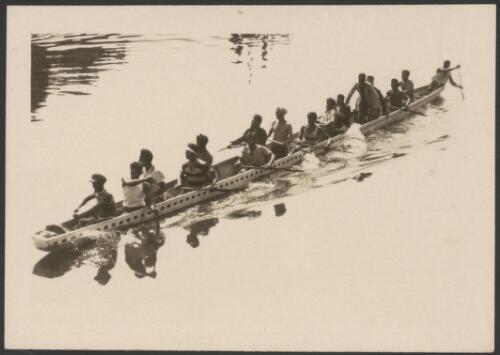 Maoris paddling war canoe at Rotorua, New Zealand, September 1928 [picture]