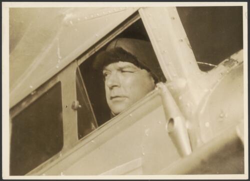 Charles Ulm in the cockpit of Faith in Australia, Avro X monoplane VH-UXX, Mascot Aerodrome, Sydney, 1933 [picture]