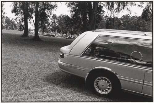 Hearse parked in the cemetery at Bellingen, New South Wales, 2003 [picture] / Jon Rhodes