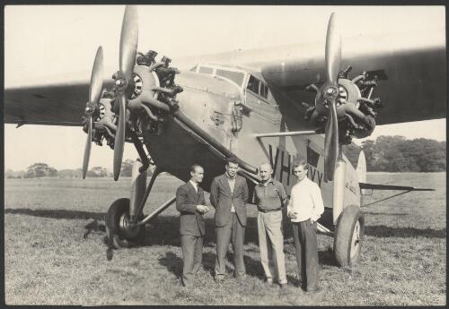 Scotty Allan, Charles Ulm, P.G. Taylor and J.A.W. Edwards in front of Faith in Australia, Avro X monoplane VH-UXX at Heston Aerodrome, England, 25 July 1933 [picture]